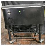 Rolling Party cooler 77Qt capacity. Bottle opener