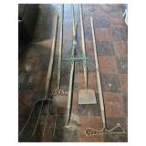 Long handled tools: metal rake, rake, hoe, pitch