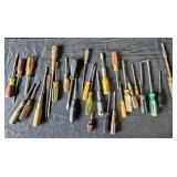 Screwdrivers. Mostly flathead, a few Phillips