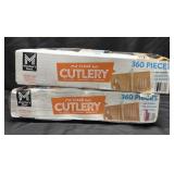 Two boxes of 360 pieces of clear cutlery.