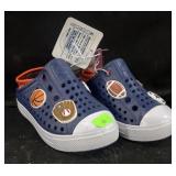 Size 6 little kids crocs with croc charms.