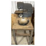 Vintage Craftsman band saw mounted on stand,