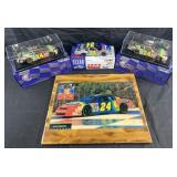 3 Jeff Gordon die-cast cars and vintage wall