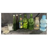 Group of decorated bottles and decanter