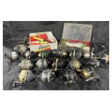 Group of vintage fishing reels, bobbers & fly