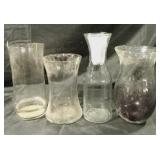 4 different sized vases