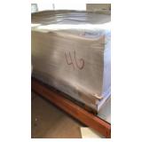 4 SKIDS OF PAPER (BOTTOM OF ORANGE SHELVING)