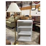 White Wooden Bookshelf and Brass Floor Lamp