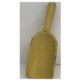 Yellow painted wooden scoop
