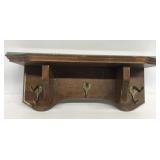 Wooden shelf with coat hangers