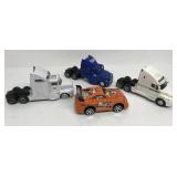 Group of semi trucks and race car max warehouse,