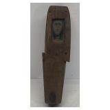 Handmade wooden coffin with whittled out figure