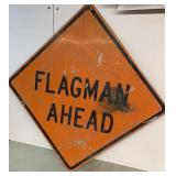 Road sign "Flagman Ahead"