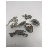 Costume jewelry brooches and pins