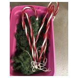 Christmas lighted candy canes and green