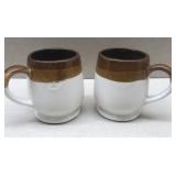 Pair brow pottery mugs