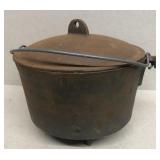 Cast iron footed pot with lid