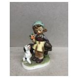 Girl and dog figurine