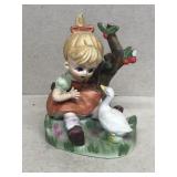 Girl and duck figurine