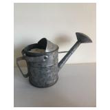Galvanized water can