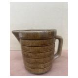 Brown stoneware measuring cup