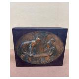 decorative wooden box with brass scenery of man