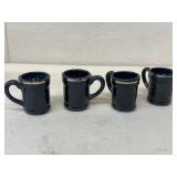 Miniature porcelain mugs made in Japan. One does