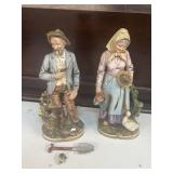 Farmer and wife figurines farmer is broken shovel