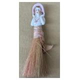 Whisk broom porcelain doll