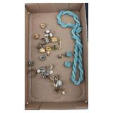 Various earrings and beaded necklace