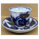 Flow blue antique leaf pattern, cup, and saucer