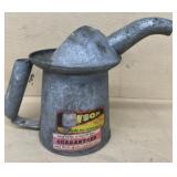 Galvanized oil can with label