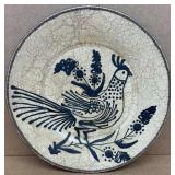 Decorative terracotta plate with painted quail