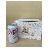 Precious moments, safe in the hands of love