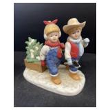 Denim days, boy and  girl with Christmas tree