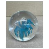 Turquoise colored clear, glass paperweight