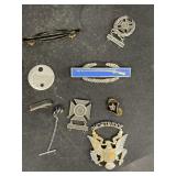 Military hat, pen, and badges