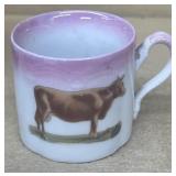 Germany, child's cup with cow