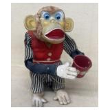 Battery operated, crap shooting monkey