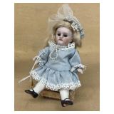 Rare antique porcelain doll with chair