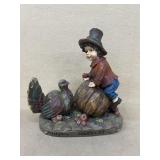 Happy harvest, wooden carved boy with turkey