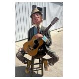 Large papier-mï¿½chï¿½ guitar player