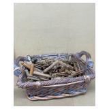 Wooden clothes, pins in basket