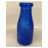 Cobalt blue milk bottle bottle of milk is a