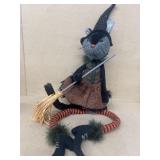 Halloween cat dressed up as witch decoration