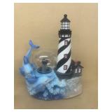 Dolphin lighthouse sculpture