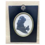 Silhouette of girl holding cat