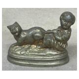 Solid brass little girl, pulling cats tail