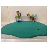 Primitive man and a woman playing golf