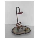 Tin sculpture of Park bench with light and